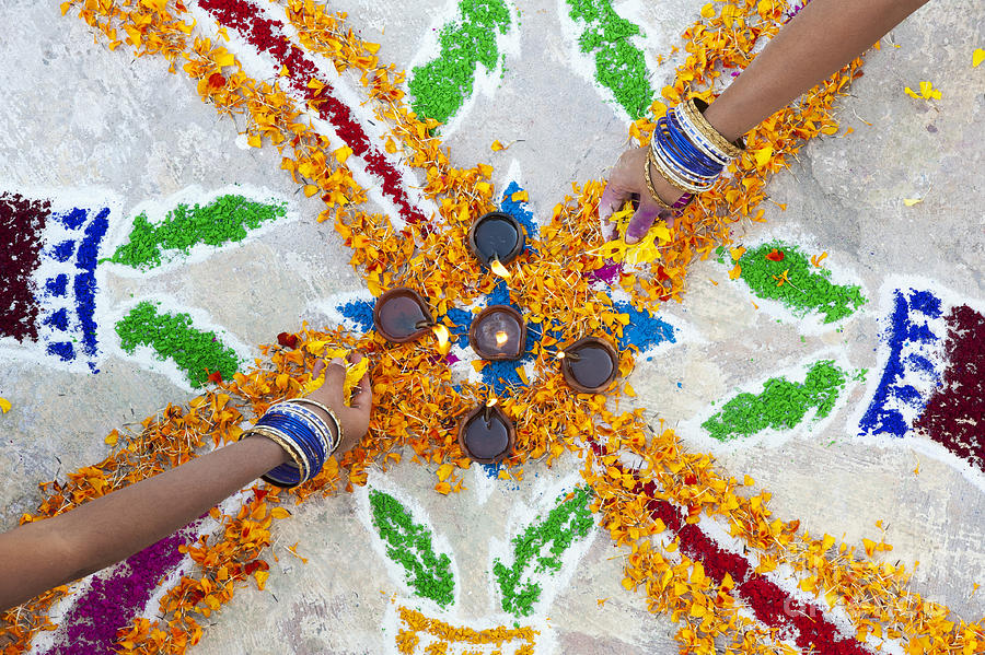 Making Rangoli with Flower Petals and Oil Lamps Photograph by Tim Gainey