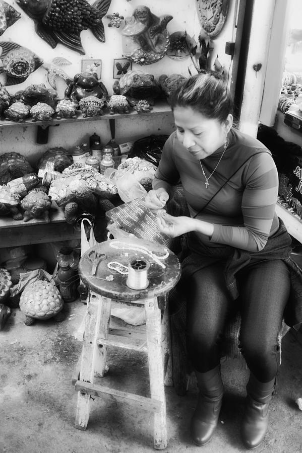 Making seashell rosaries Photograph by Hugh Smith
