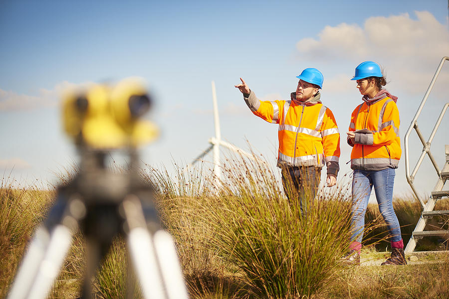 Male And Female Windfarm Engineers Photograph by Sturti