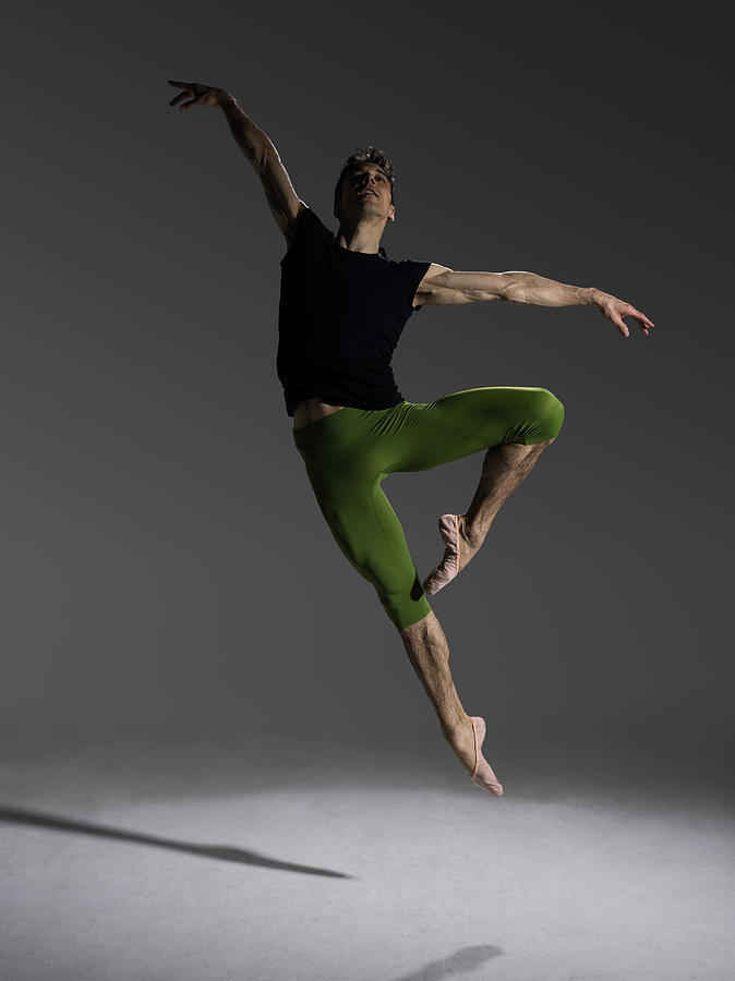 Male Ballet Dancer Jumping In Passé Photograph by Nisian Hughes