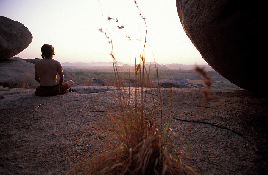 Sunset Photograph - Male Climber Meditating At Sunset by Corey Rich