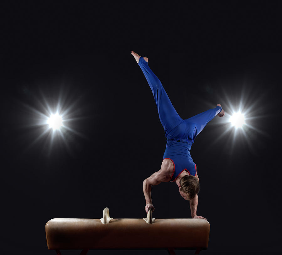 Male Gymnast Doing Handstand On Pommel Photograph by Mike Harrington
