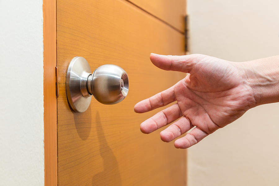 Male Hand Reaching Out To Grab A Door Knob, Good For Coming Home, Home Safety Or Intruder Concept Photograph by Yokaew