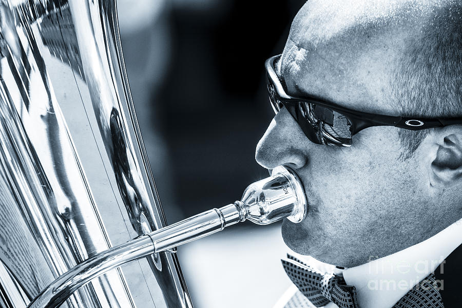 Male In Sunglasses Blowing Mouthpiece Of Tuba Photograph by Peter Noyce