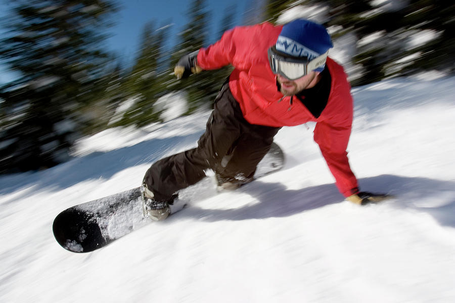 Mountain Photograph - Male Snowboarder Arcing Down Ski Run by Ken Redding