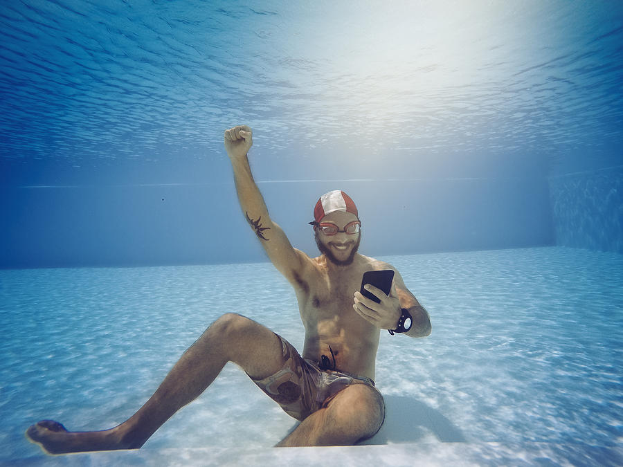 Man addicted to online gambling bets underwater Photograph by Piola666