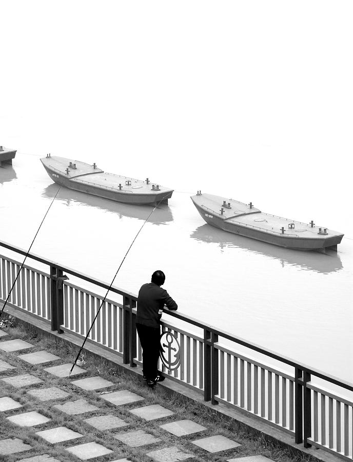 Man and Boats Photograph by Valentino Visentini