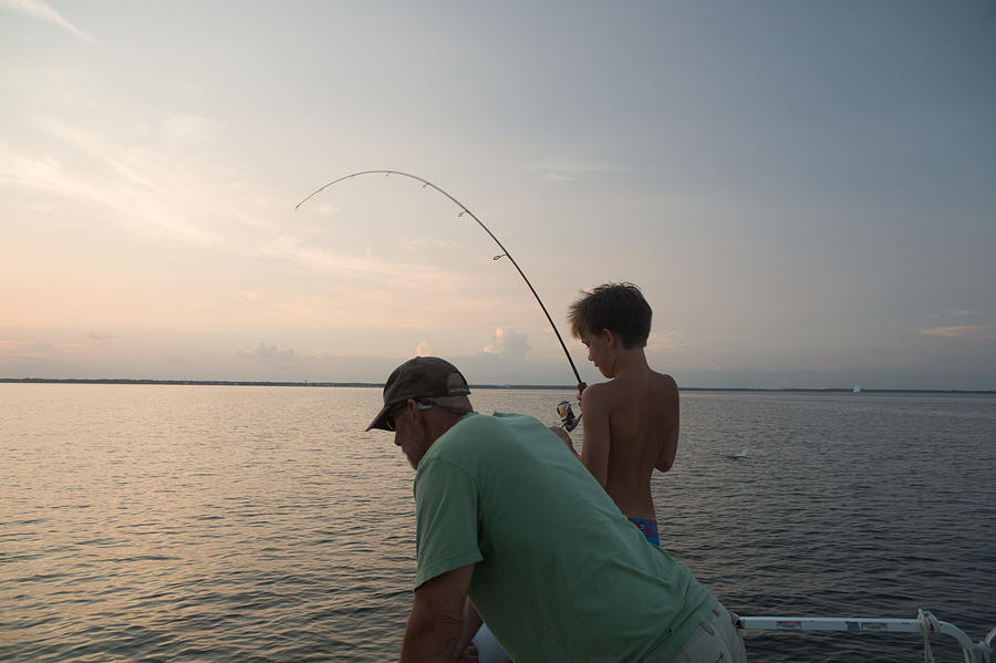 Man and Boy fishing Photograph by Sean Murphy