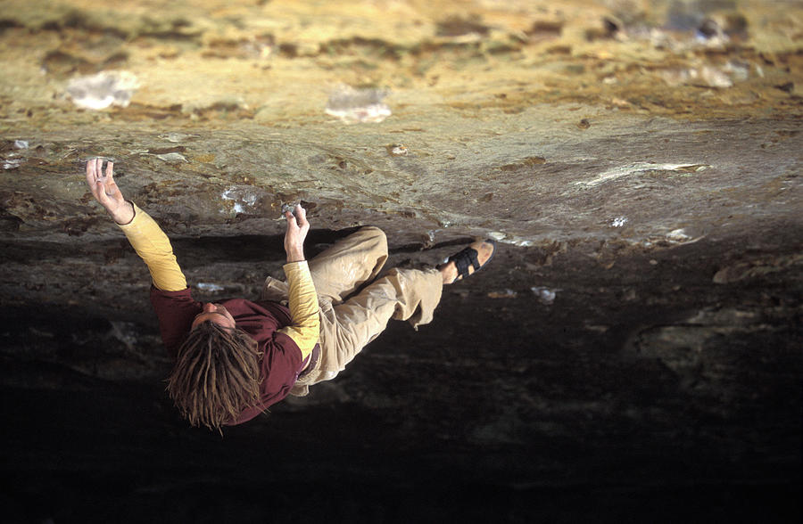 Sports Photograph - Man Bouldering On A Difficult by Corey Rich