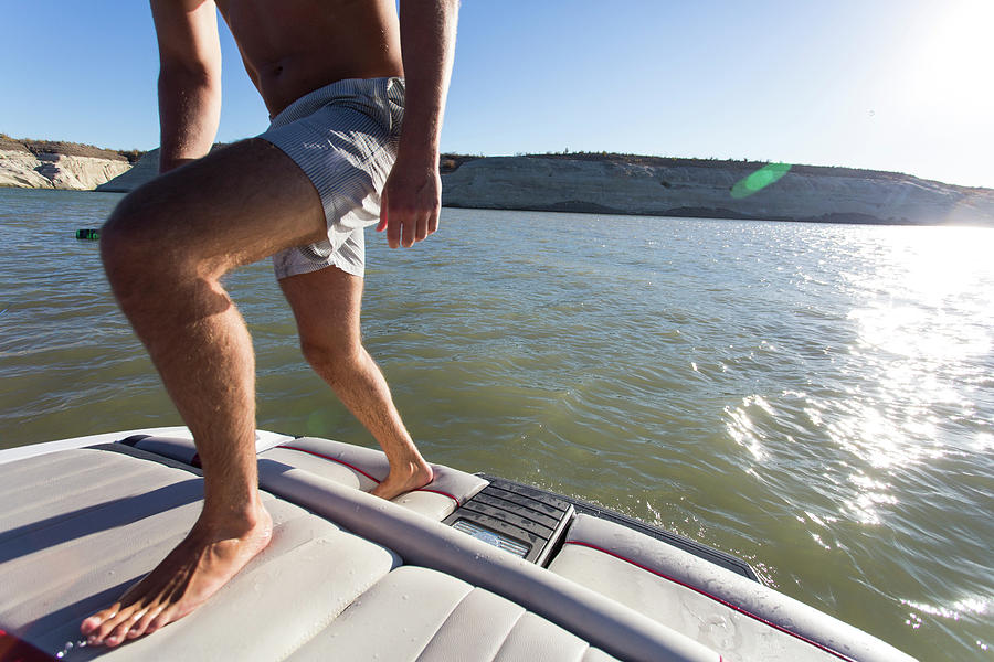 Man Climbing Aboard Wakeboard Boat Photograph by Wray Sinclair Fine Art America