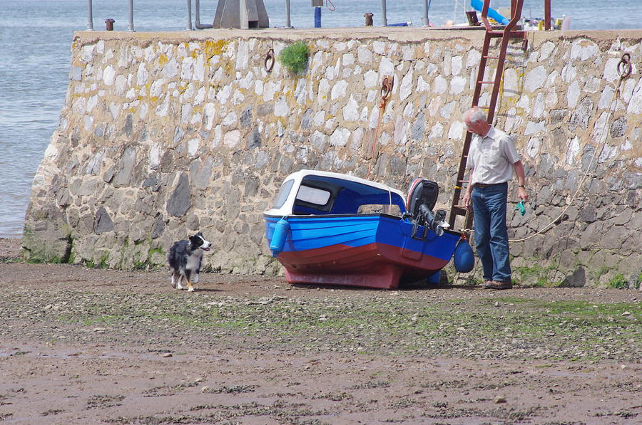 Dog Photograph - Man Dog And Boat  by Tom Salt