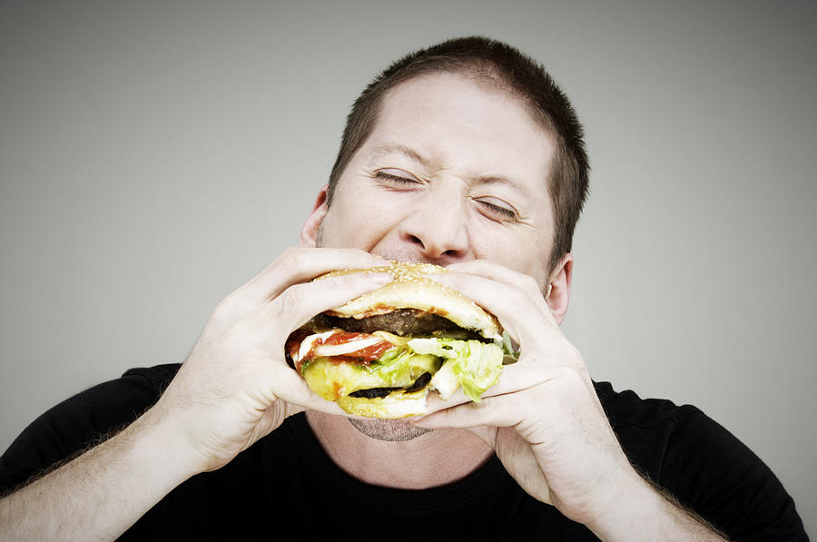 Man Eating Burger Photograph by John Rensten