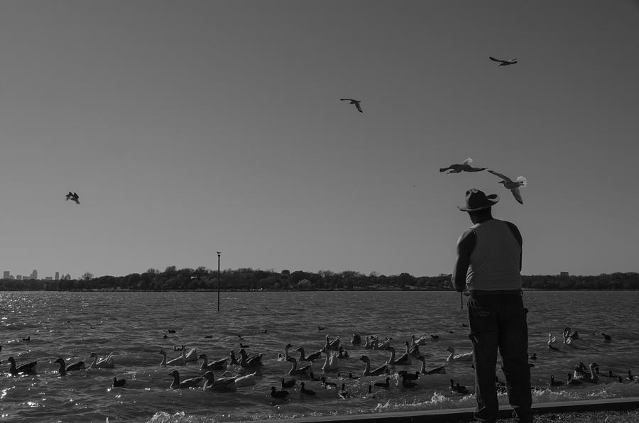 Man Feeding Birds Photograph by Enrique Morales - Fine Art America