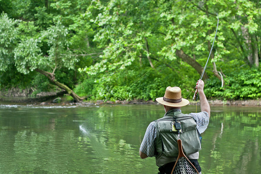 Man Fishing On Shore Of River Photograph by Wray Sinclair - Fine Art ...