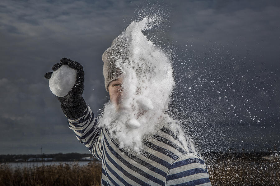 Man getting hit by snowball in the face Photograph by David Trood