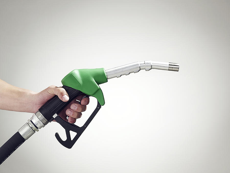 Man holding a petrol pump, close-up of hand Photograph by Walker and Walker