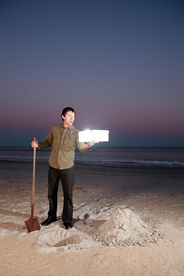 Sunset Photograph - Man Holds Glowing Box On Beach by Logan Mock-Bunting
