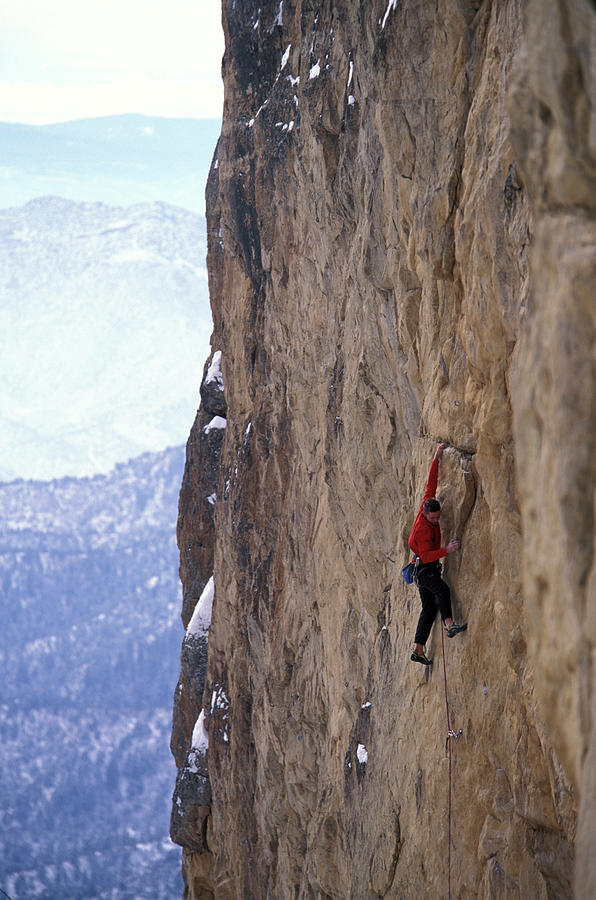Mountain Photograph - Man In A Red Shirt Lead Climbing by Corey Rich