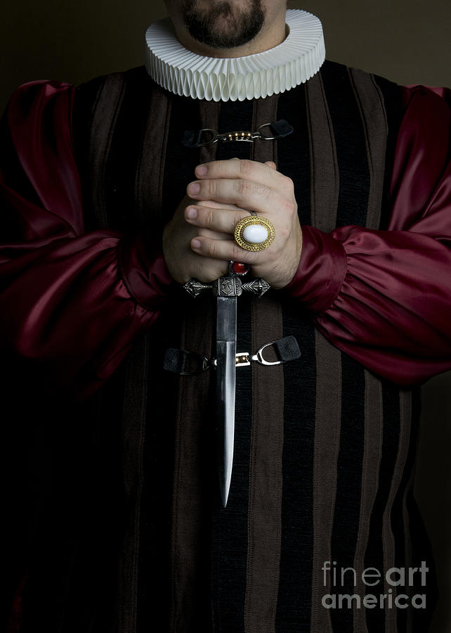 Man in baroque outfits holding a silver dagger Photograph by Jaroslaw Blaminsky