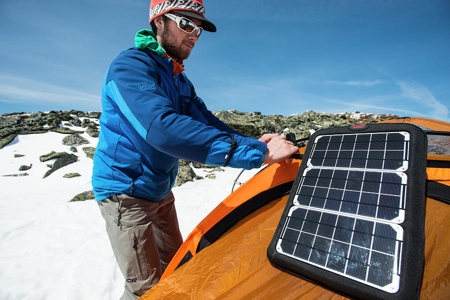 Winter Photograph - Man Installing Solar Panel On Tent by Joe Klementovich