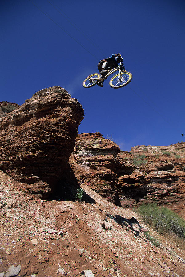 Bicycle Photograph - Man Jumping A Cliff On His Mountain by Scott Markewitz