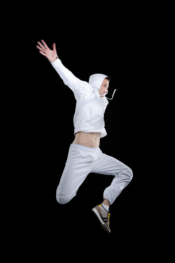 Man Jumping Indoors Photograph by Stock colors