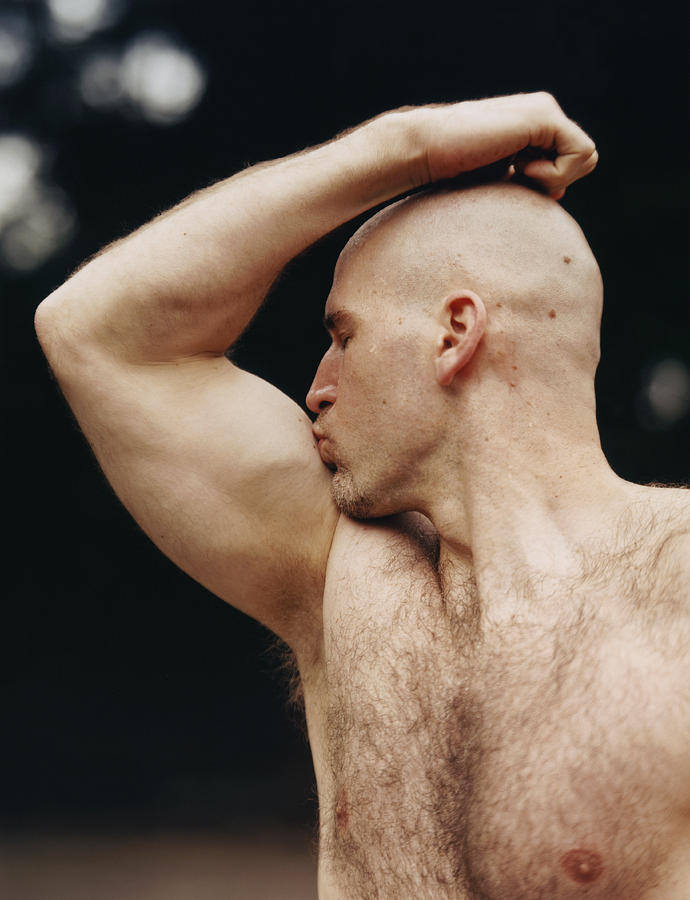 Man Kissing Biceps Photograph by Charles Gullung