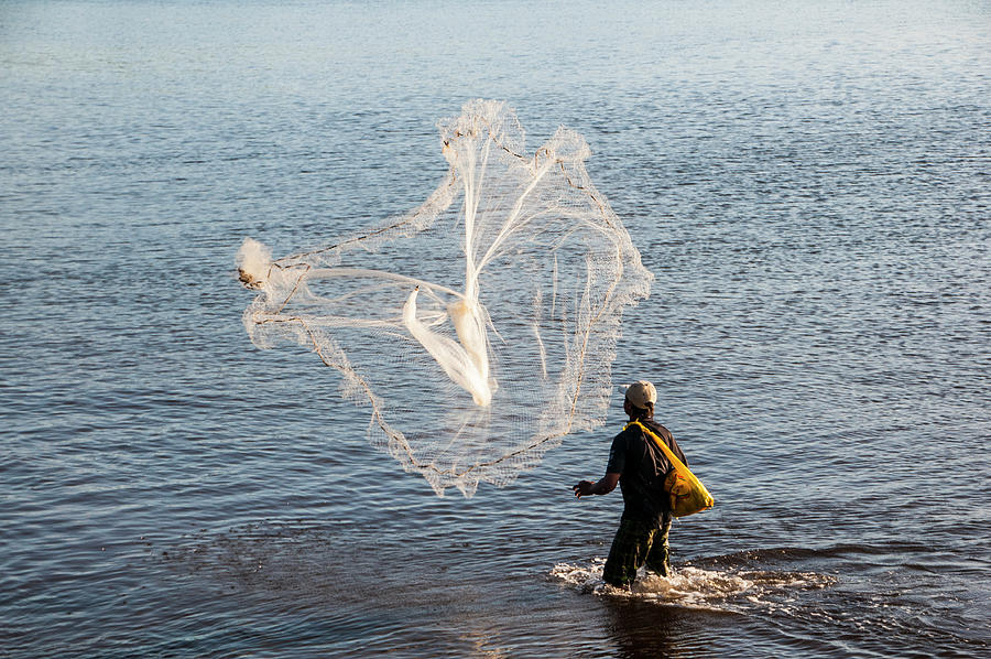 Portrait Photograph - Man Net Fishing In The Harbor Of Apia by Michael Runkel