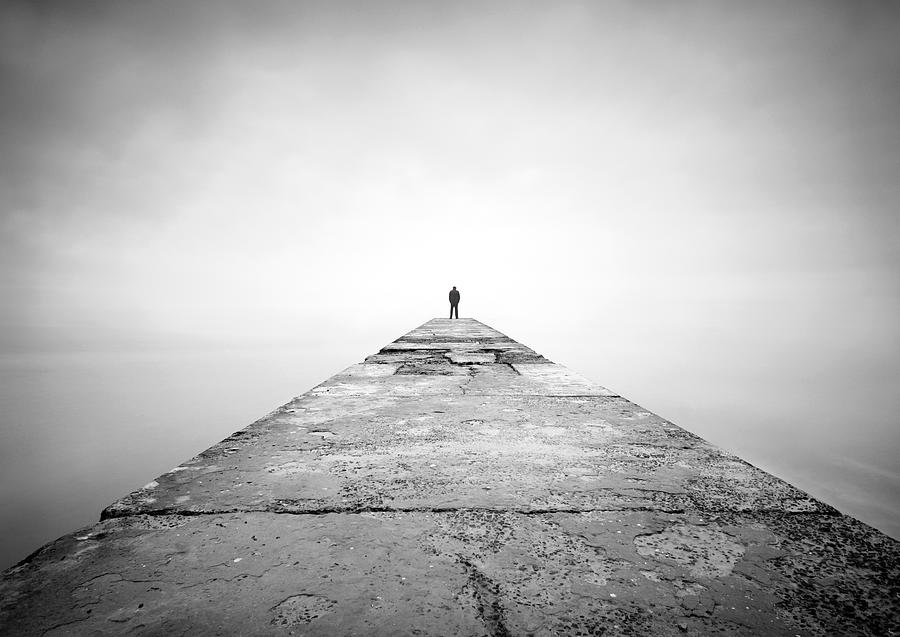 Man on the edge of pier Photograph by Dtokar