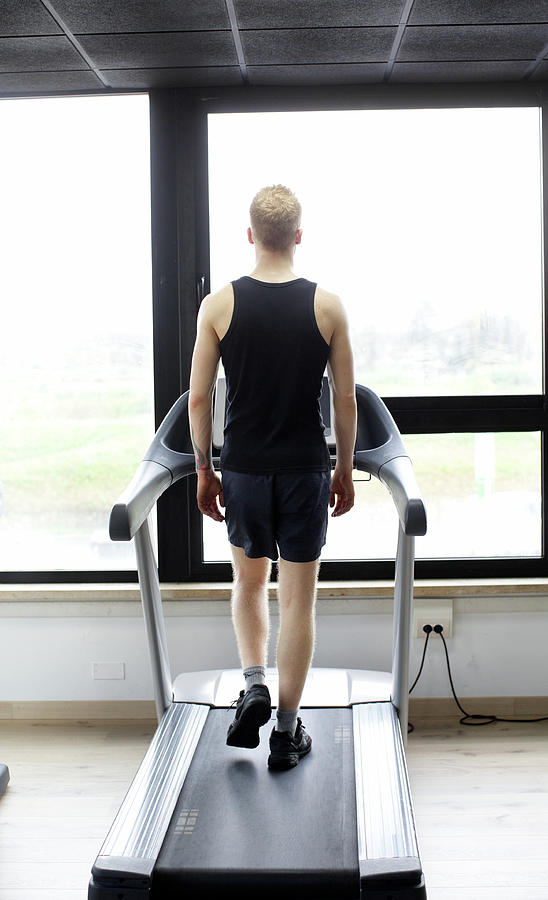 Man On Treadmill Photograph by Massimo Merlini