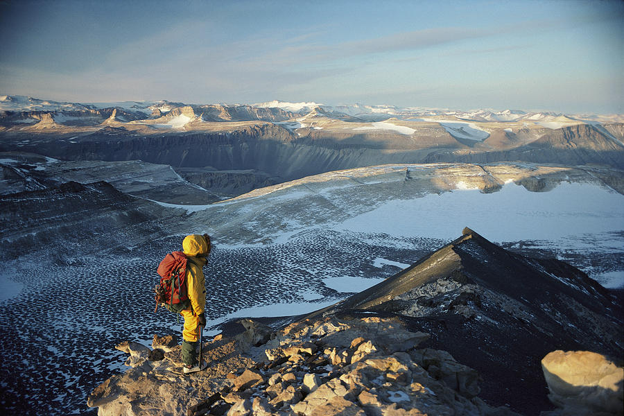 Man Overlooking Olympus Range Antarctica Photograph by Colin Monteath