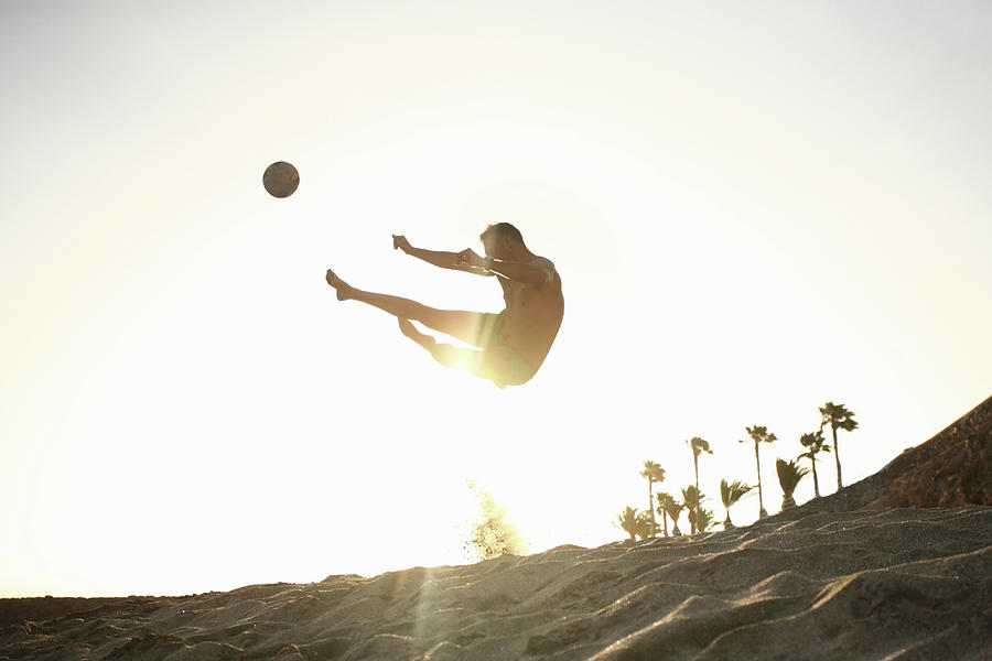 Man Playing Beach Soccer Photograph by Stanislaw Pytel
