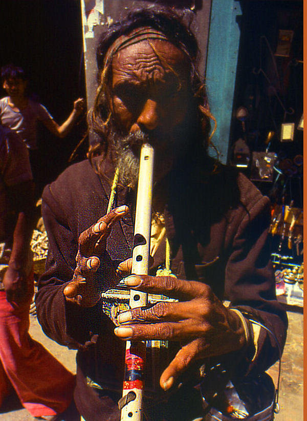 Mountain Photograph - Man Playing Flute by Serge Seymour