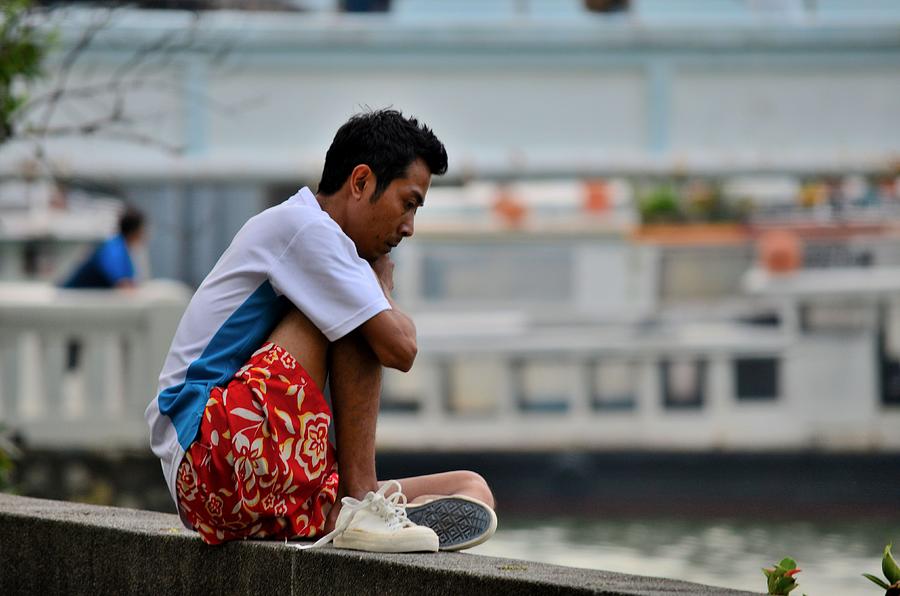 Man reflects on seaside wall Singapore Photograph by Imran Ahmed