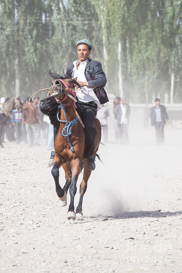 Man riding a horse at Kashgar sunday market China Photograph by Matteo Colombo