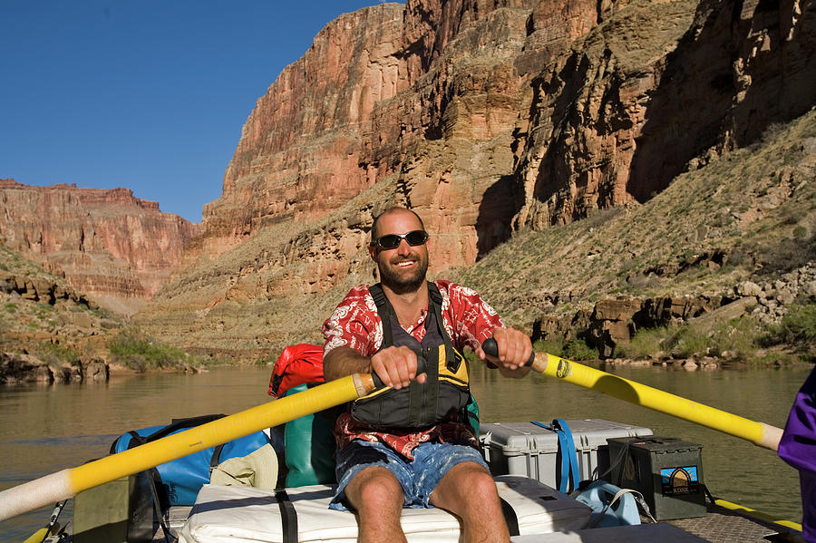 Grand Canyon National Park Photograph - Man Rowing Raft Down The Grand Canyon by Whit Richardson