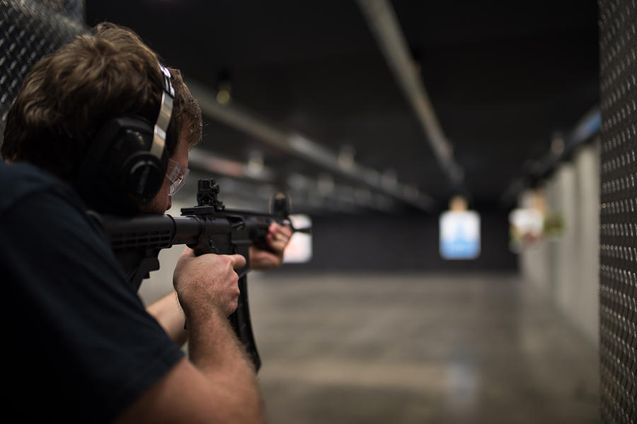 Man shooting assault rifle Photograph by Matthew Palmer