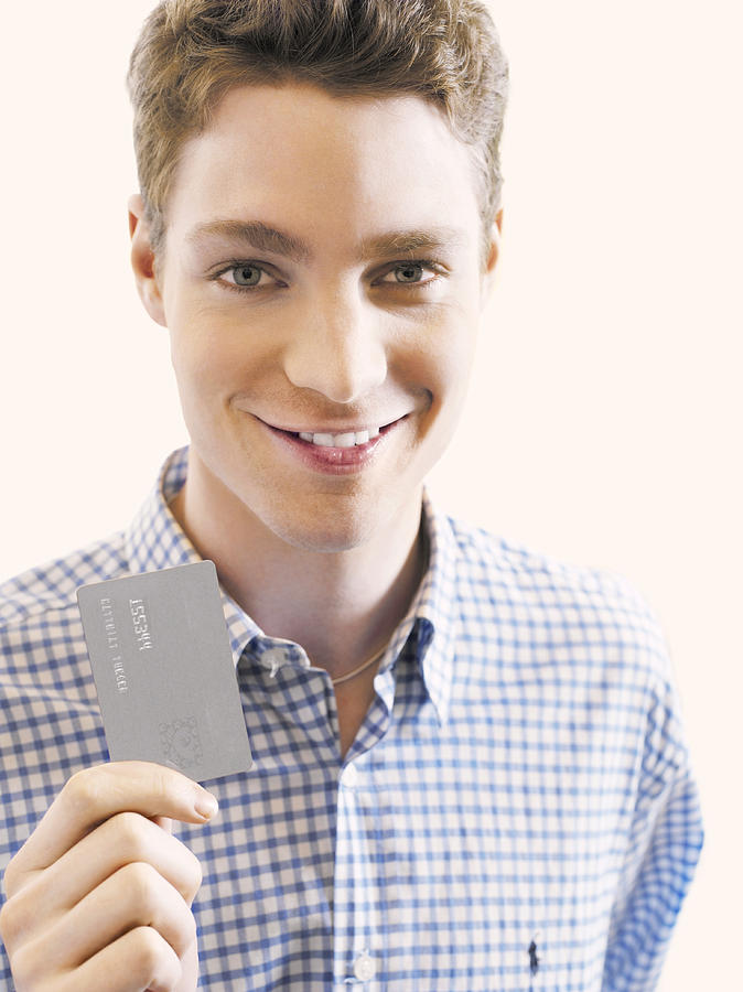 Man Showing a Credit Card Photograph by Rayman