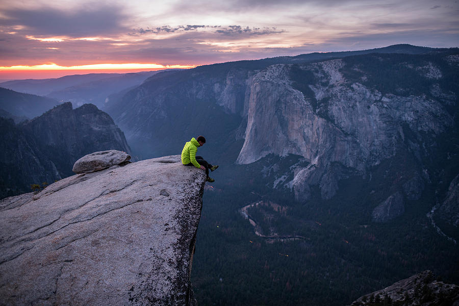 Man Sitting On The Edge Of A Big Cliff Photograph By Paolo Sartori 