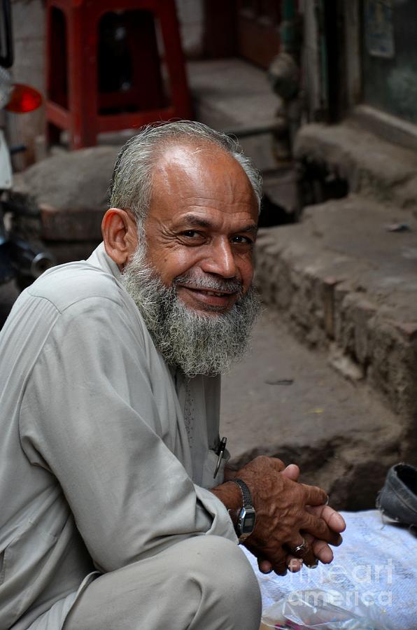 Man smiles for camera Lahore Pakistan Photograph by Imran Ahmed
