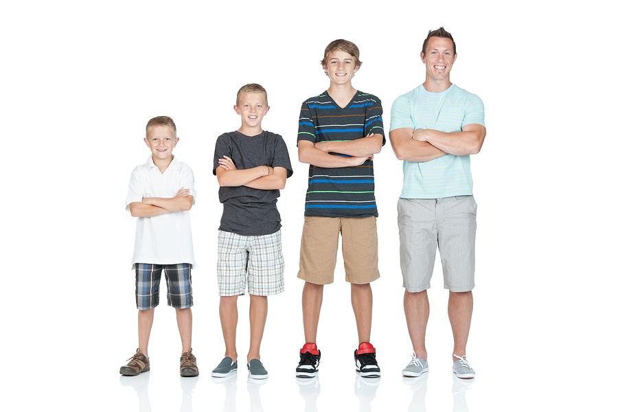 Man standing with his children in ascending order Photograph by 4x6