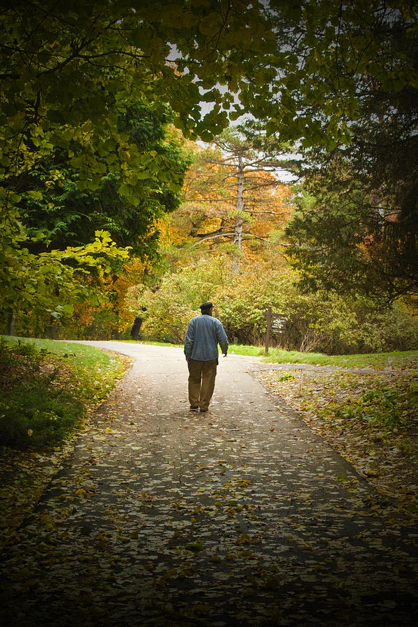 Man Taking A Path Photograph