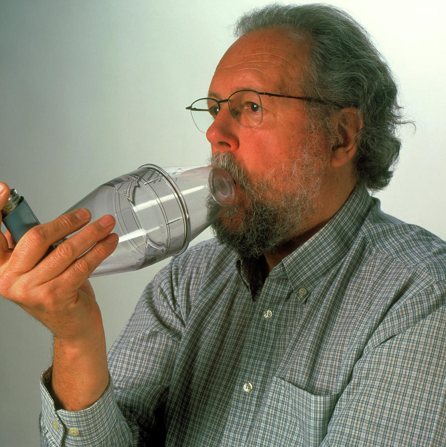 Man Using Inhaler by Science Photo Library