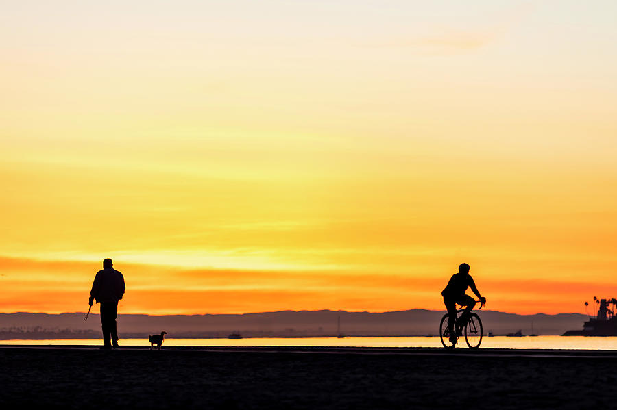 Long Beach Photograph - Man Walking Dog And Cyclist At Sunrise by Fat Tony