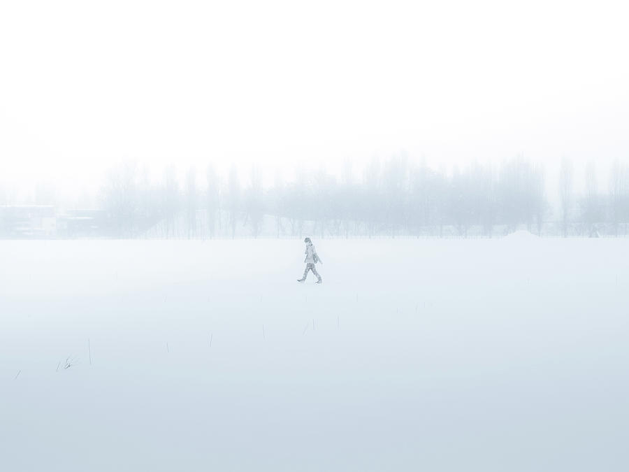 Man Walking Through A Snowfield Photograph by Taketan Man Walking Through A Snowfield Photograph by Taketan