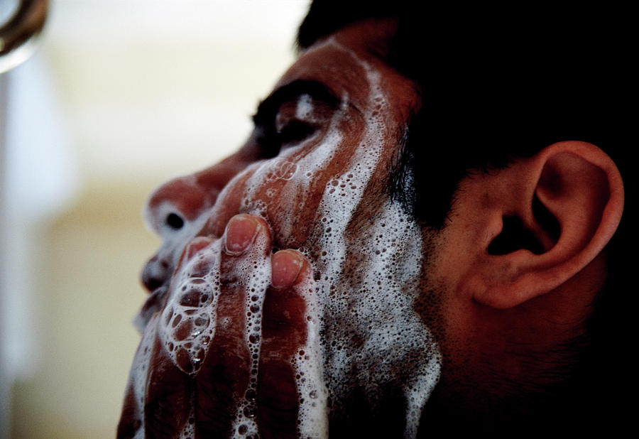 Man Washing Face Photograph by Tracy Rutter/science Photo Library