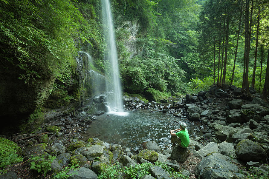 Man Watching A Waterfall In Lush Photograph by Ippei Naoi