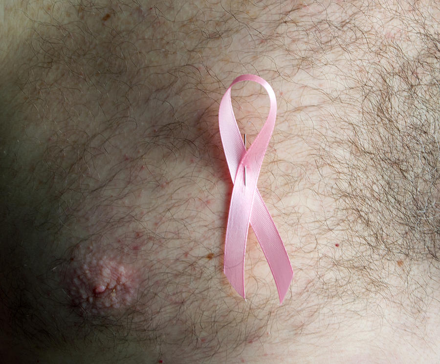 Man wearing a Pink Breast Cancer Awareness Ribbon on his bare chest Photograph by Luis Diaz Devesa