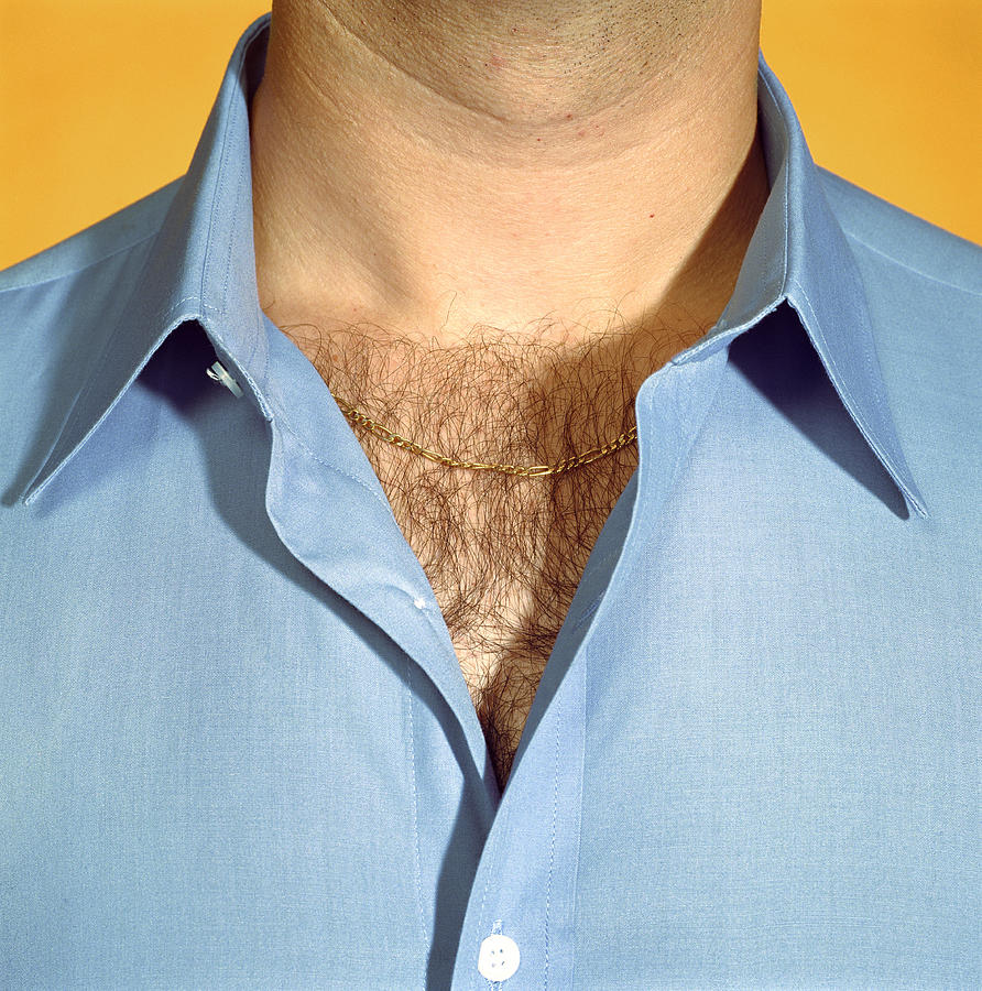 Man wearing blue shirt with chest hair visible, close-up Photograph by Paul Taylor
