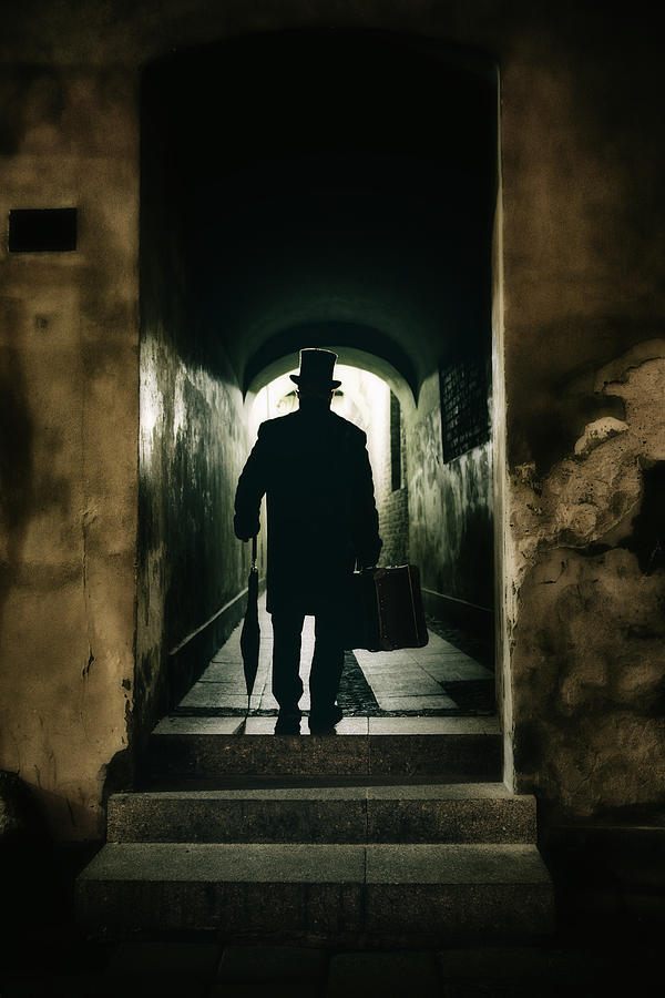 Back view of a victorian man wearing top hat and long coat in the alley Photograph by Jaroslaw Blaminsky